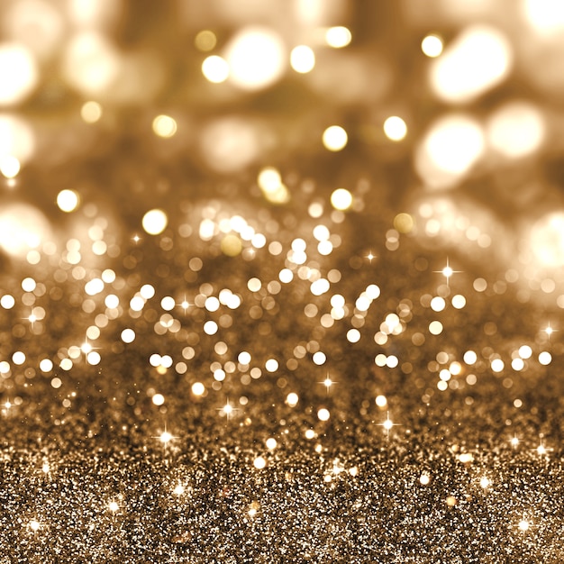 Golden christmas glitter background with stars and bokeh lights