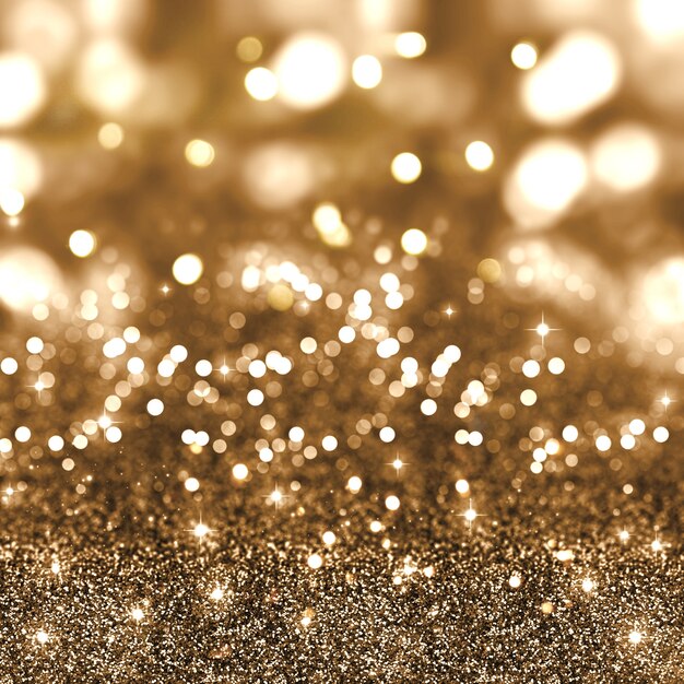 Golden christmas glitter background with stars and bokeh lights