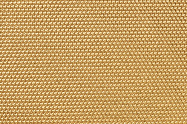 Golden colored honeycomb pattern wallpaper