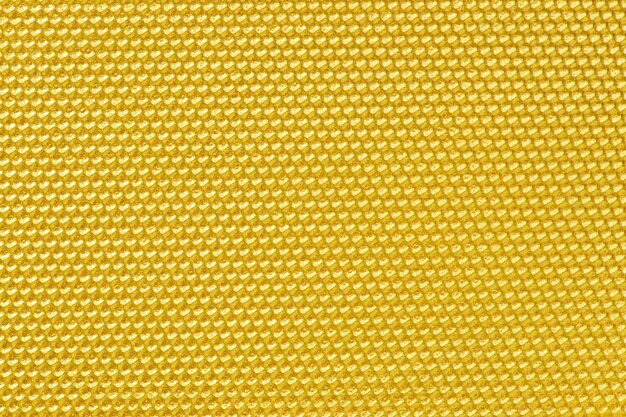 Golden colored honeycomb pattern wallpaper