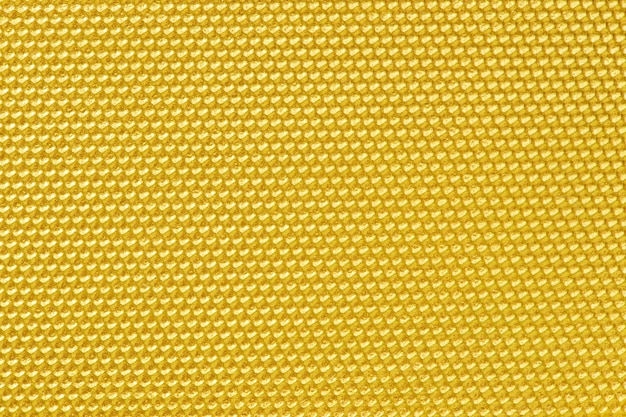 Golden colored honeycomb pattern wallpaper