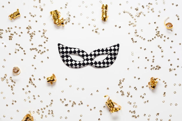 Free photo golden confetti frame and mask