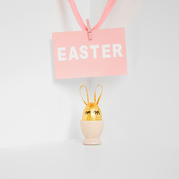 Golden Easter egg in holder