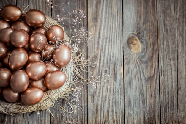 Golden Easter eggs on a nest