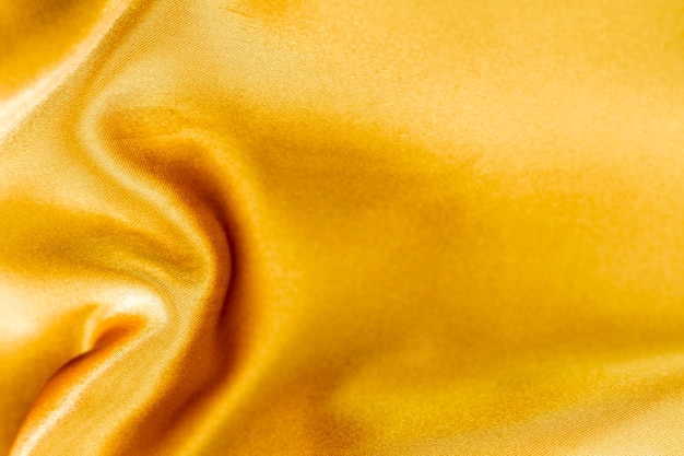 Golden fabric material texture with copy space