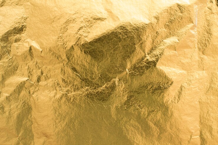黄金箔のテクスチャ背景、光沢のある包装紙の装飾要素