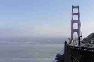 Free photo golden gate bridge covered in the fog at daytime in san francisco, california