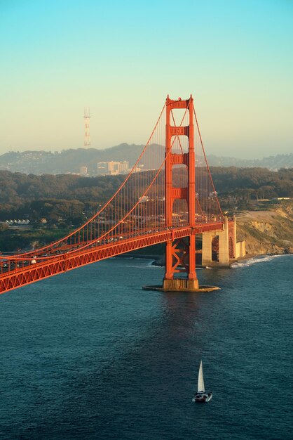 Golden Gate Bridge in San Francisco with sailing boat.