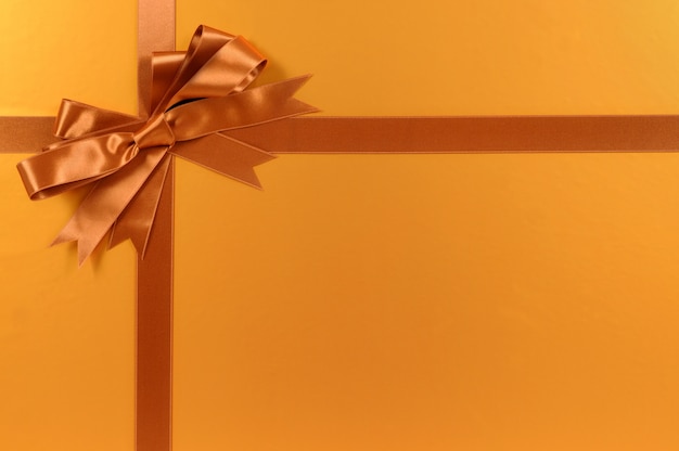 Golden gift with elegant bow