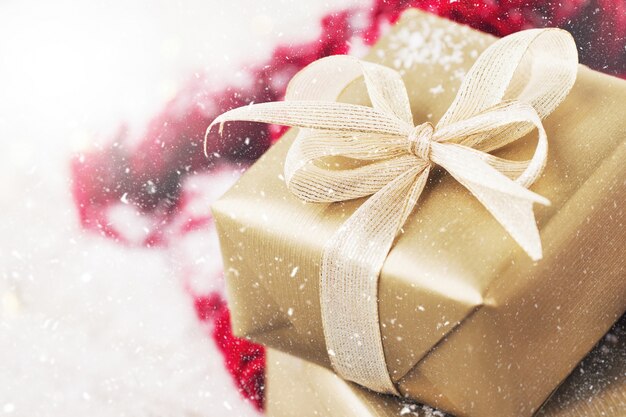 Free photo golden gift with white bow