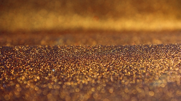 Free photo golden glitter bokeh lights background