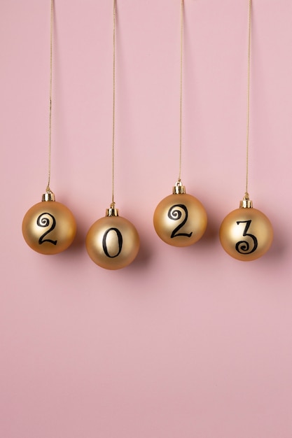 Golden globes with pink background still life