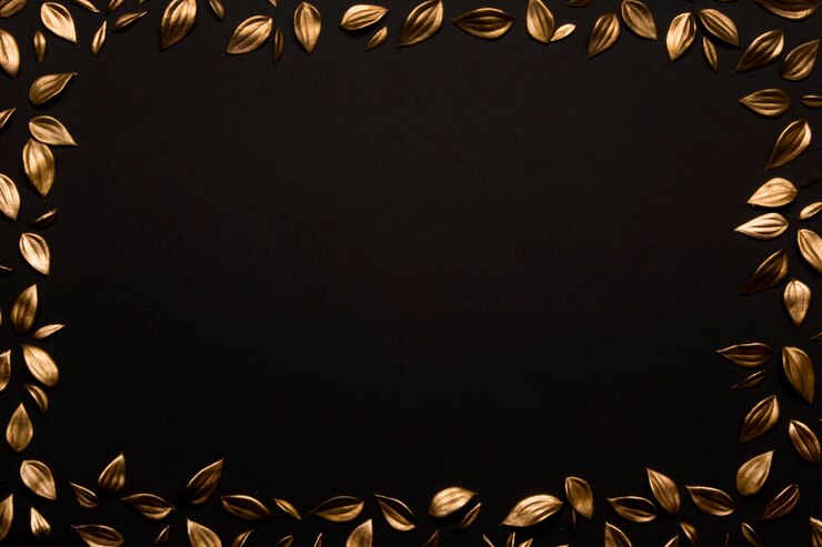 Free Photo golden leaves on black background copy space