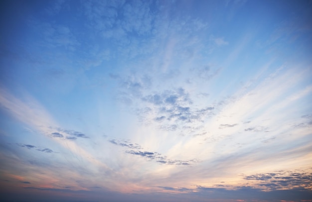 Free photo golden light shining through the clouds in a colorful evening.