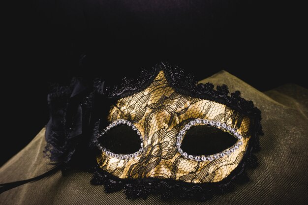 Golden mask on a yellow fabric