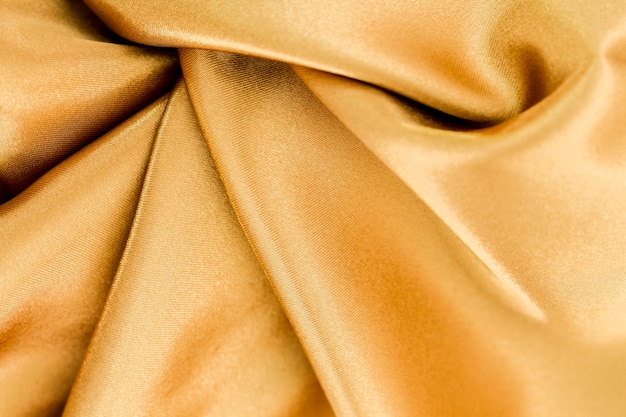 Golden material surface with twisted waves