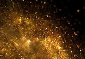 Free photo golden particles background