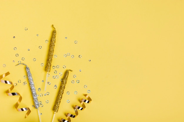 Golden ribbon and candles with copy space