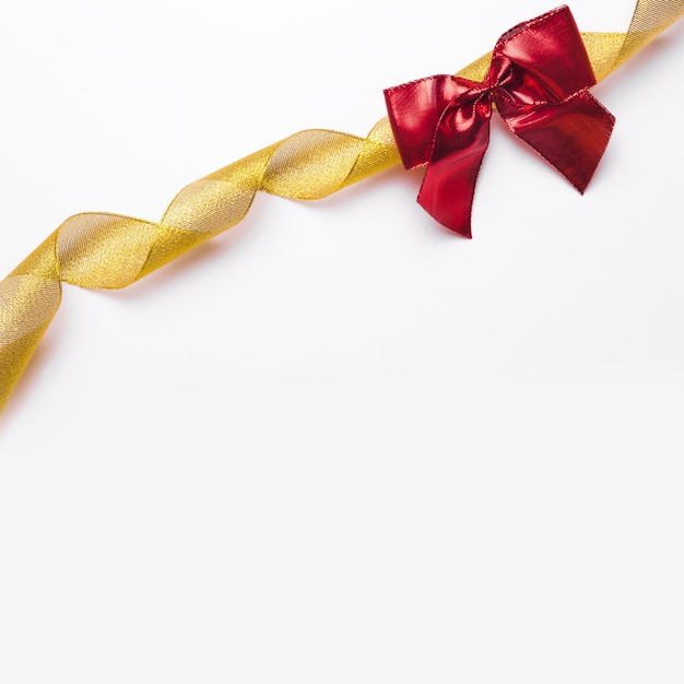 Golden ribbon and red bow