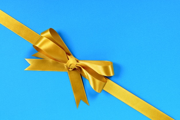 Free photo golden ribbon with blue gift