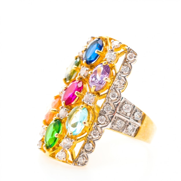 Free photo golden ring with several gemstones