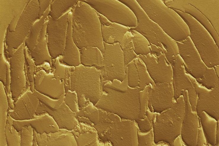 Free Photo golden rough paint textured background