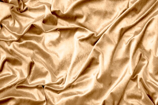 Текстура золотой блестящей шелковой ткани