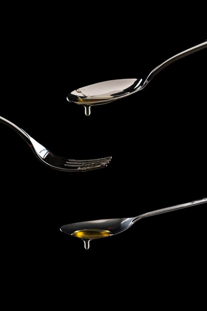 golden sweet honey dripping from spoon 