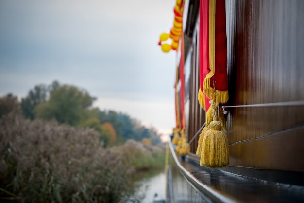 Golden tassels hanging over a boat in Elburg, Netherlands