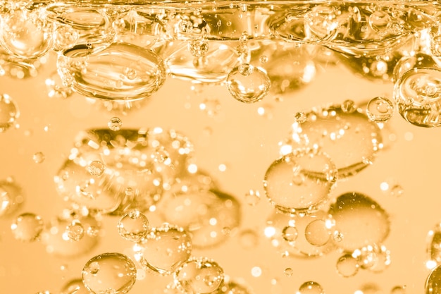 Golden underwater bubbles abstract in oil