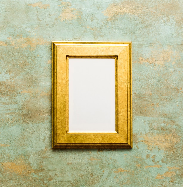 Free photo golden wooden frame isolated on oxidized background