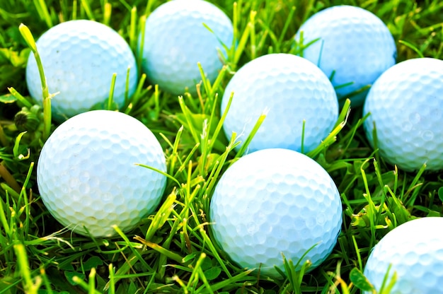 Free photo golf balls on the grass