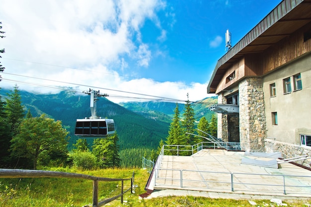 Gondola cable car in mountains.