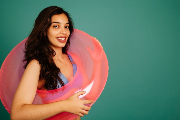 Good looking woman with inflatable ring