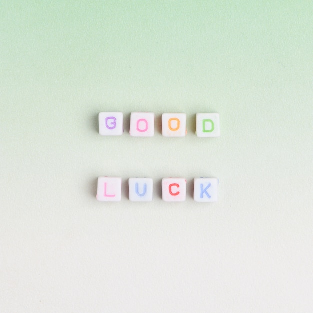 GOOD LUCK beads text typography on green