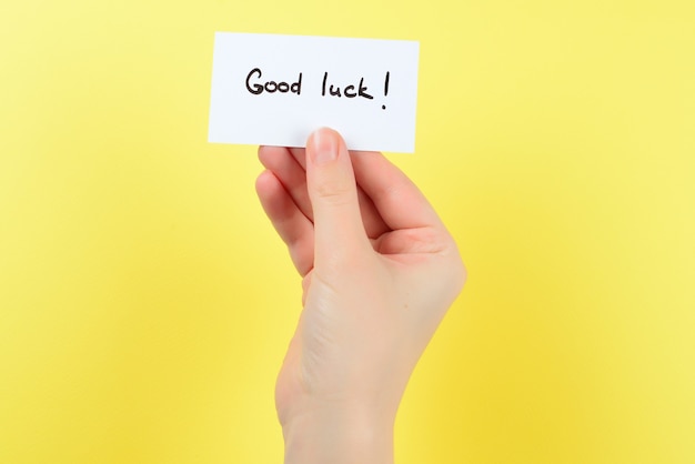 Good luck text on a card on a yellow background.