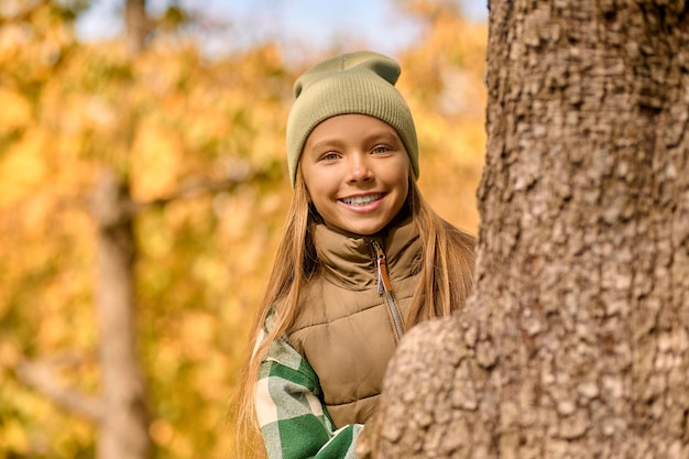 Free photo good mood. a cute girl feeling good while playing in the park