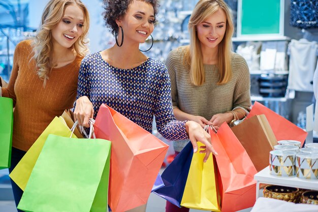 Good mood of girls in the shopping mall