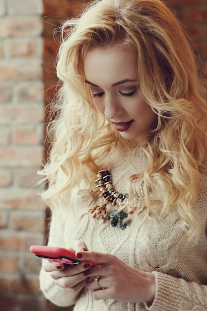 Gorgeous blond woman texting