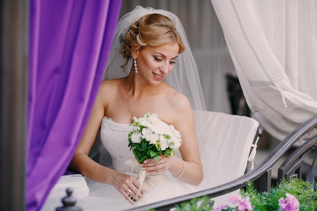 Gorgeous bride holding her bouquet