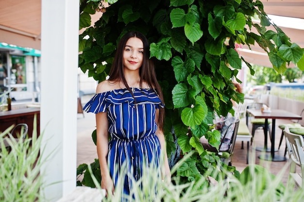 Gorgeous brunette girl portrait in cafe