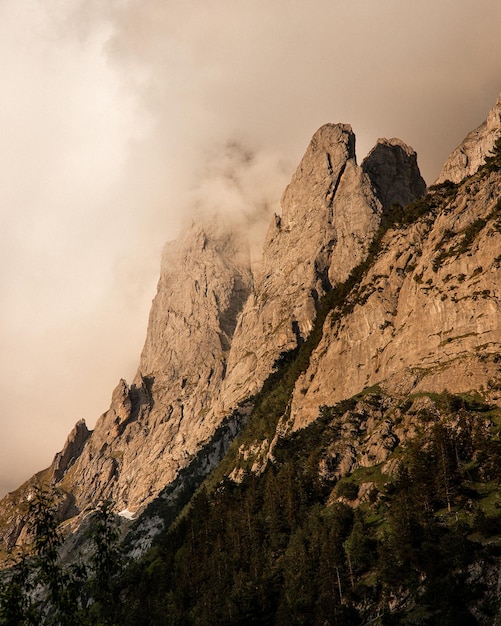 Gorgeous cliff in clouds on the sunset