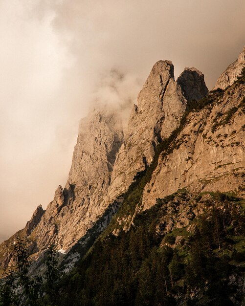 Gorgeous cliff in clouds on the sunset