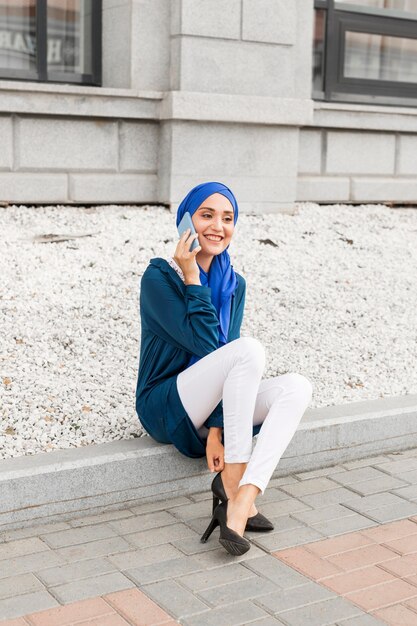 Gorgeous girl talking on the phone outside