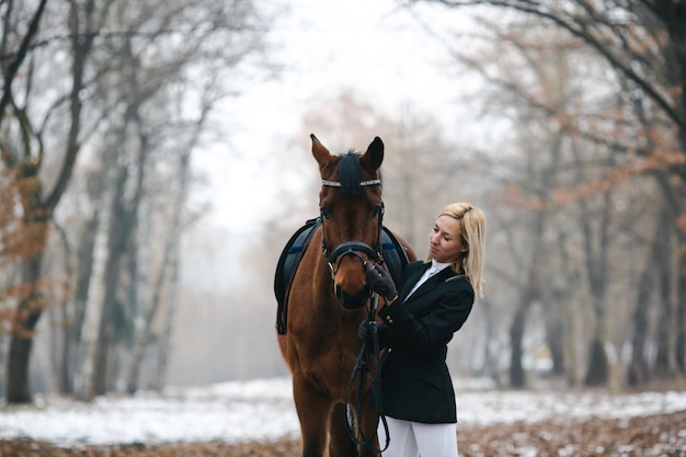 Gorgeous horse and owner in woods