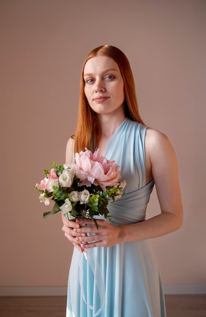 Gorgeous portrait of bridesmaid with flower boquete