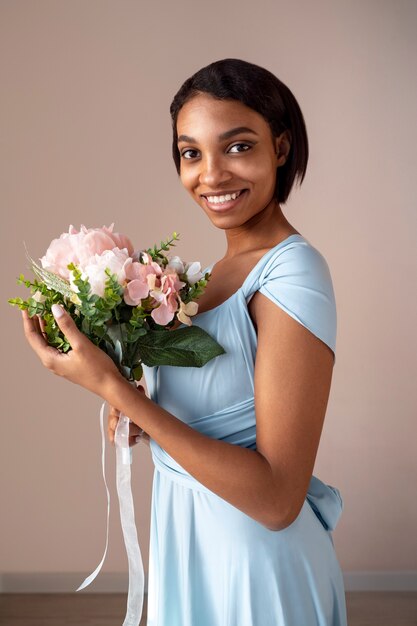 Gorgeous portrait of bridesmaid with flower boquete