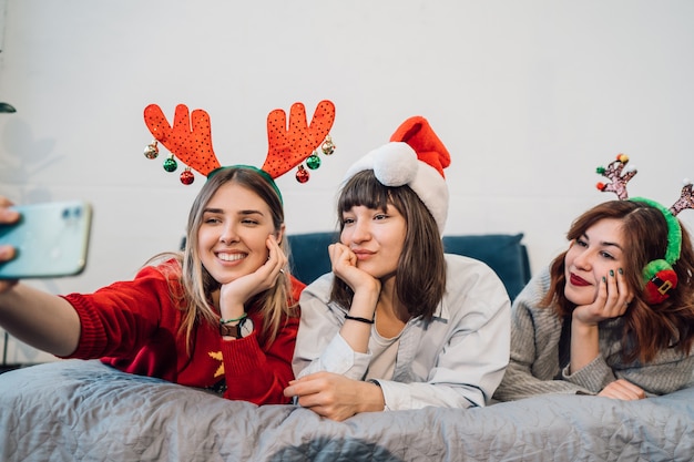 Gorgeous smiling friends having fun and take selfie