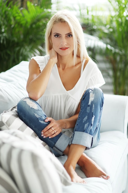 Gorgeous woman relaxing on the sofa at home