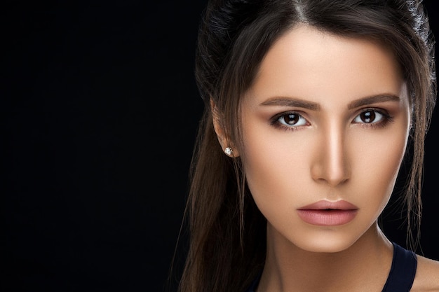 Gorgeous woman with perfect skin and makeup after beauty salon